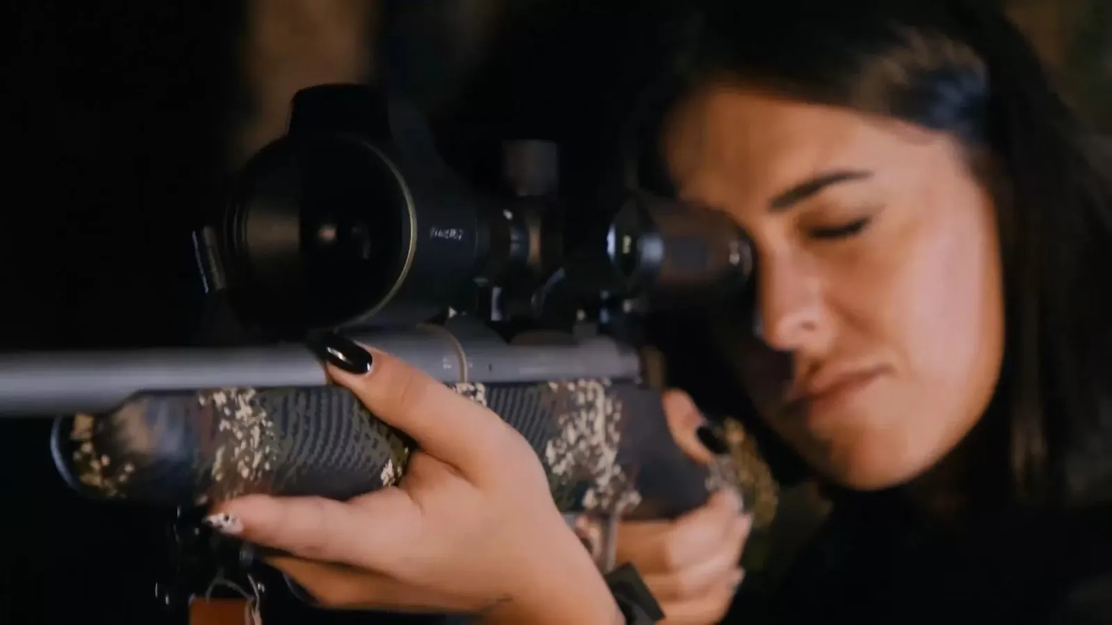 Hunter aiming a rifle fitted with a Pixfra thermal scope at night – thermal scope with LRF